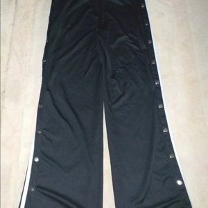 Fashion nova warm up pants with snap sides, 2 snaps are missing